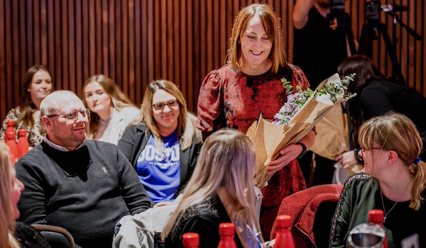 Dawson & Sanderson general manager Julie Cloe handed out bouquets to long-serving employees.