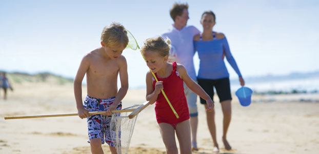Family on beach in Summer