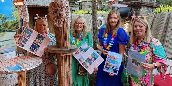 Carly Charteris (right) at a Premier Holidays beach party event
