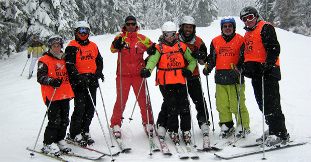 group on skis in the snow