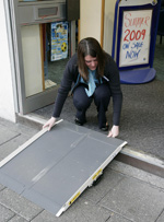 Thomas Cook Plymouth staff place a ramp at the entrance