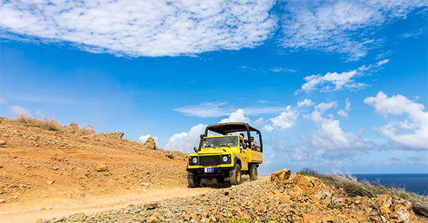 A Jeep driving along the track