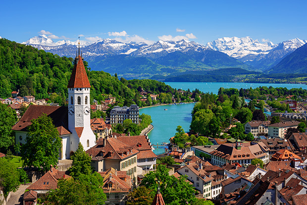 Historical Thun city and lake Thun with snow covered Bernese Highlands swiss Alps mountains in background, Canton Bern, Switzerland