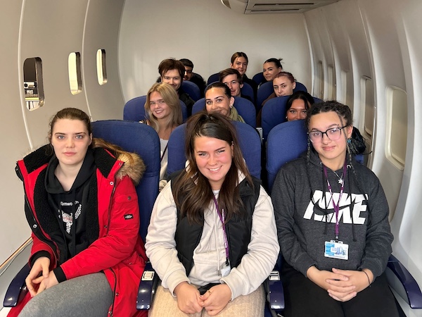Second-year travel & tourism students in the BMet 'aircraft cabin'