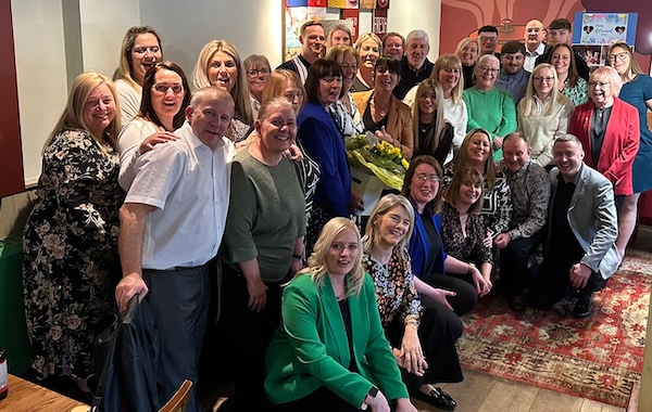 Althams head office staff and branch managers help Beryl celebrate her retirement.